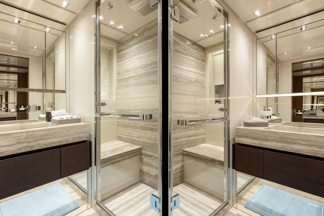 a bathroom with a glass shower aboard INSIEME Yacht for Sale