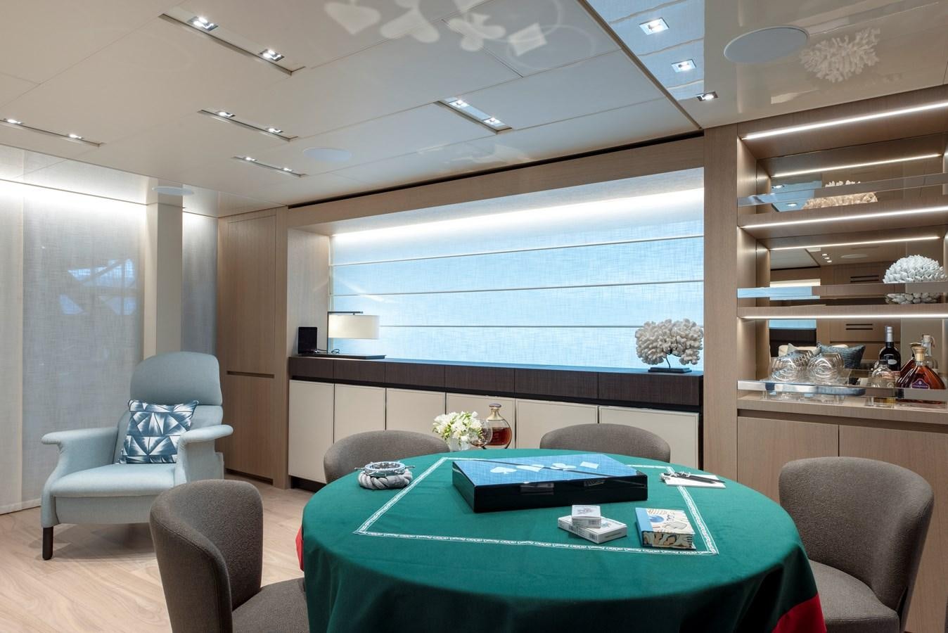 a room with a table and chairs aboard INSIEME Yacht for Sale