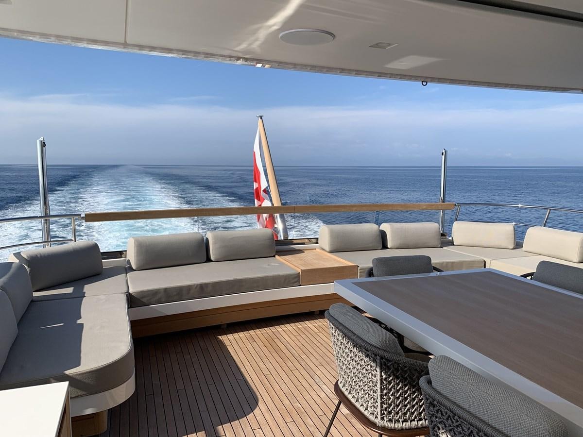 a deck with chairs and a large body of water aboard INSIEME Yacht for Sale