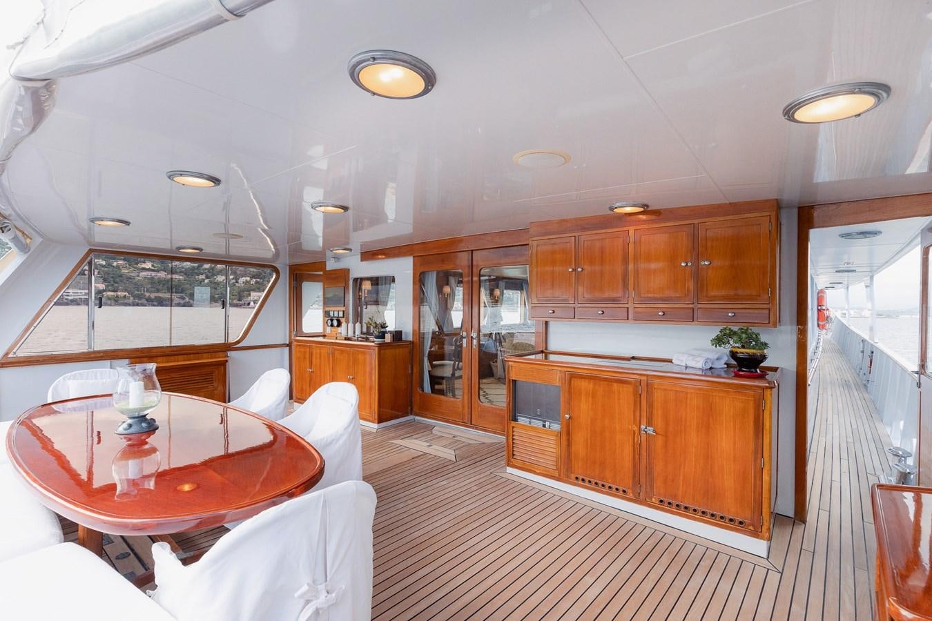 a kitchen with wooden cabinets aboard GIN TONIC Yacht for Sale