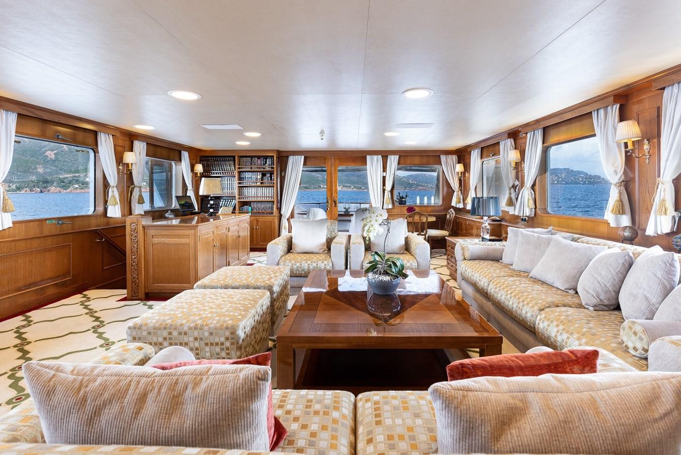 a living room with a large window aboard GIN TONIC Yacht for Sale