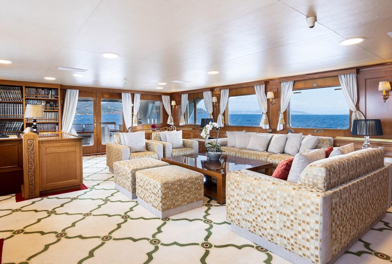 a living room with a large window aboard GIN TONIC Yacht for Sale