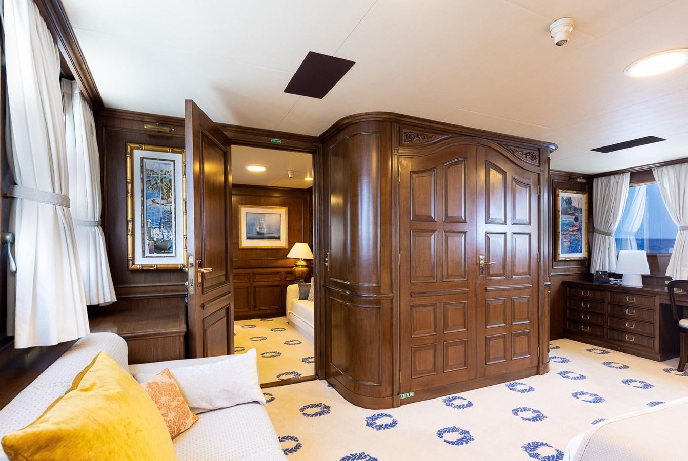 a bedroom with a wood cabinet aboard GIN TONIC Yacht for Sale