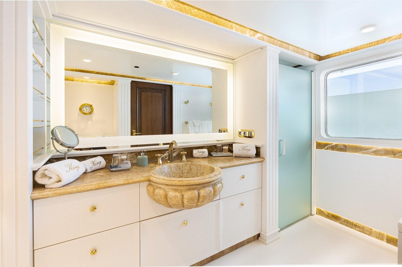 a bathroom with a sink and a mirror aboard GIN TONIC Yacht for Sale
