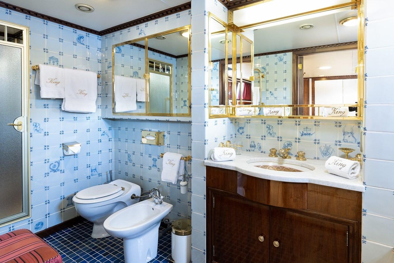 a bathroom with a sink toilet and a mirror aboard GIN TONIC Yacht for Sale