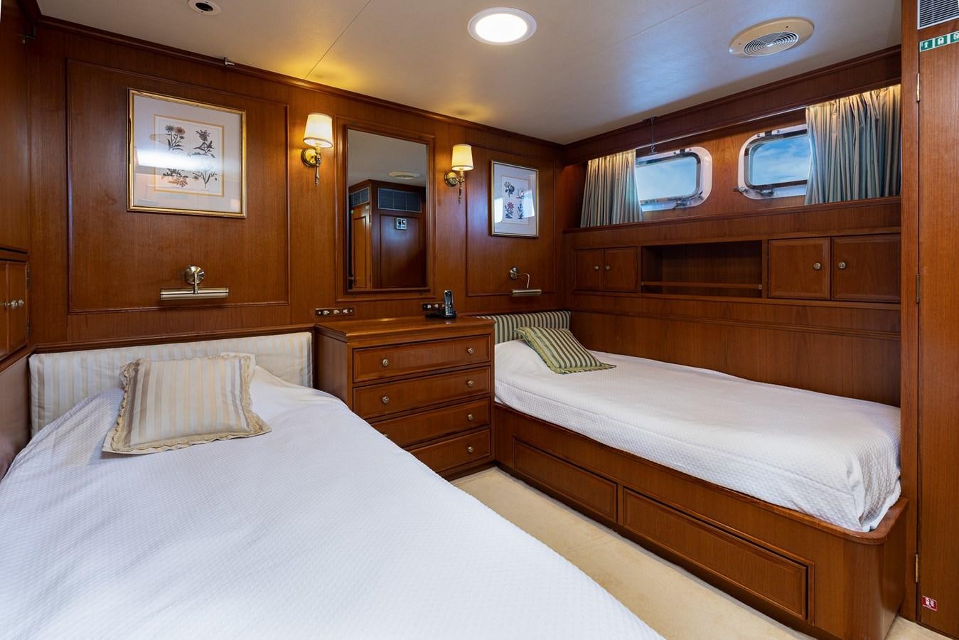 a room with two beds aboard GIN TONIC Yacht for Sale