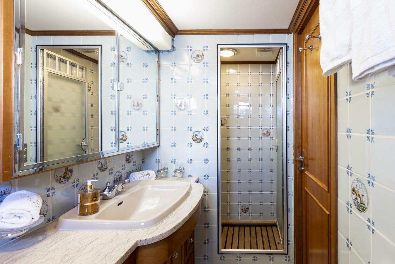 a bathroom with a glass shower aboard GIN TONIC Yacht for Sale