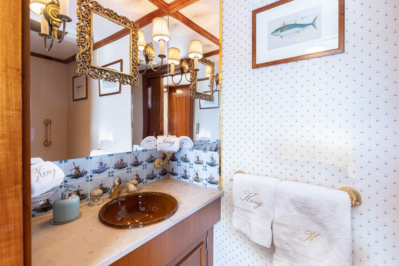 a bathroom with a sink and a mirror aboard GIN TONIC Yacht for Sale