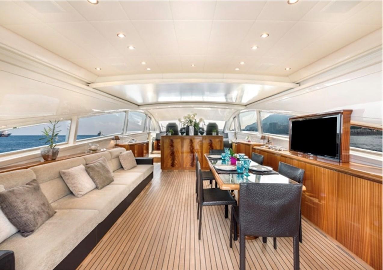 a living room with a couch and a table aboard LEOPARD 27M Yacht for Sale