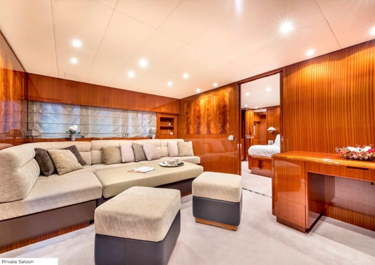 a living room with a couch and a table aboard LEOPARD 27M Yacht for Sale