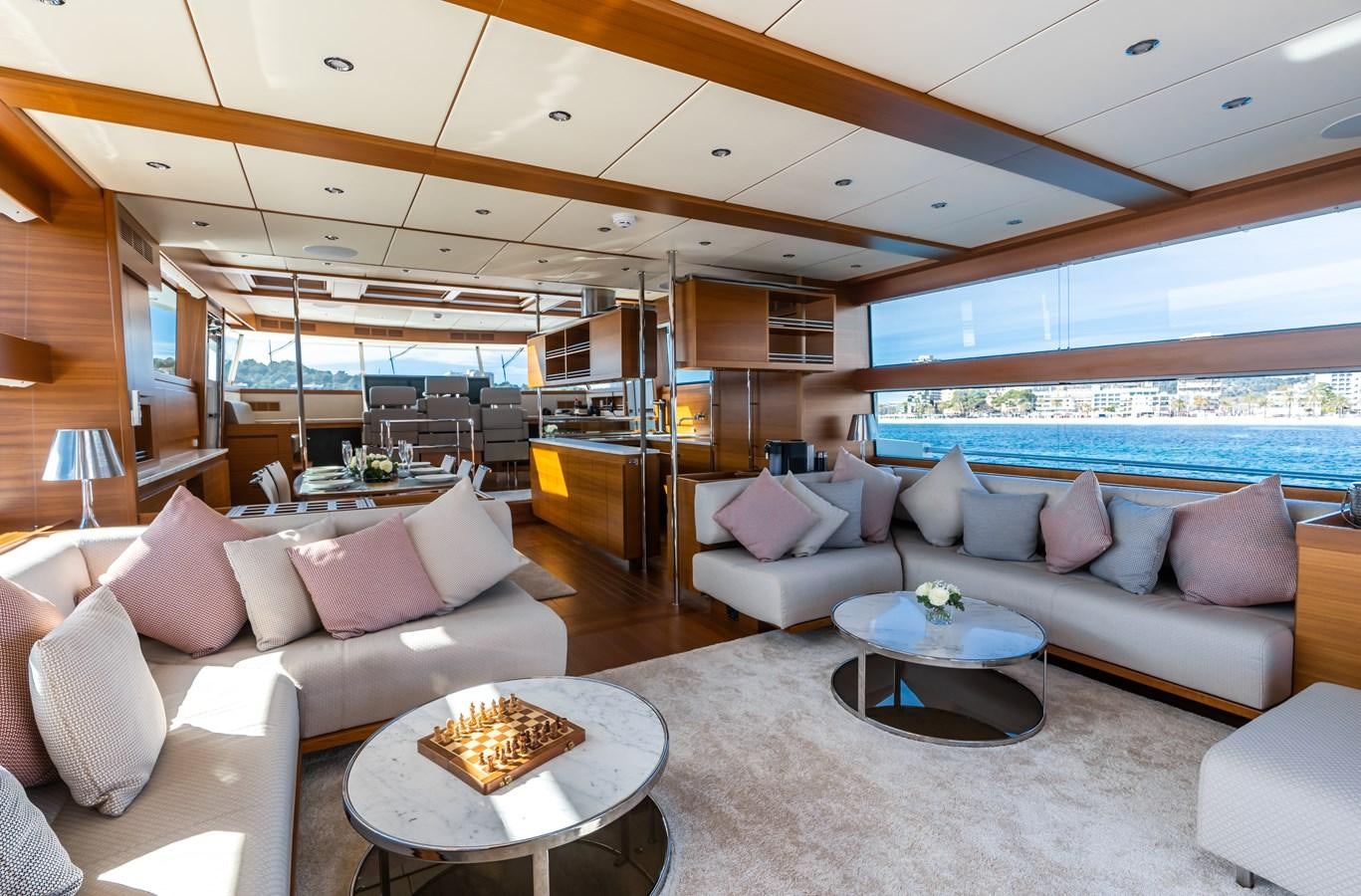 a living room with a large window aboard SHOCKWAVE Yacht for Sale