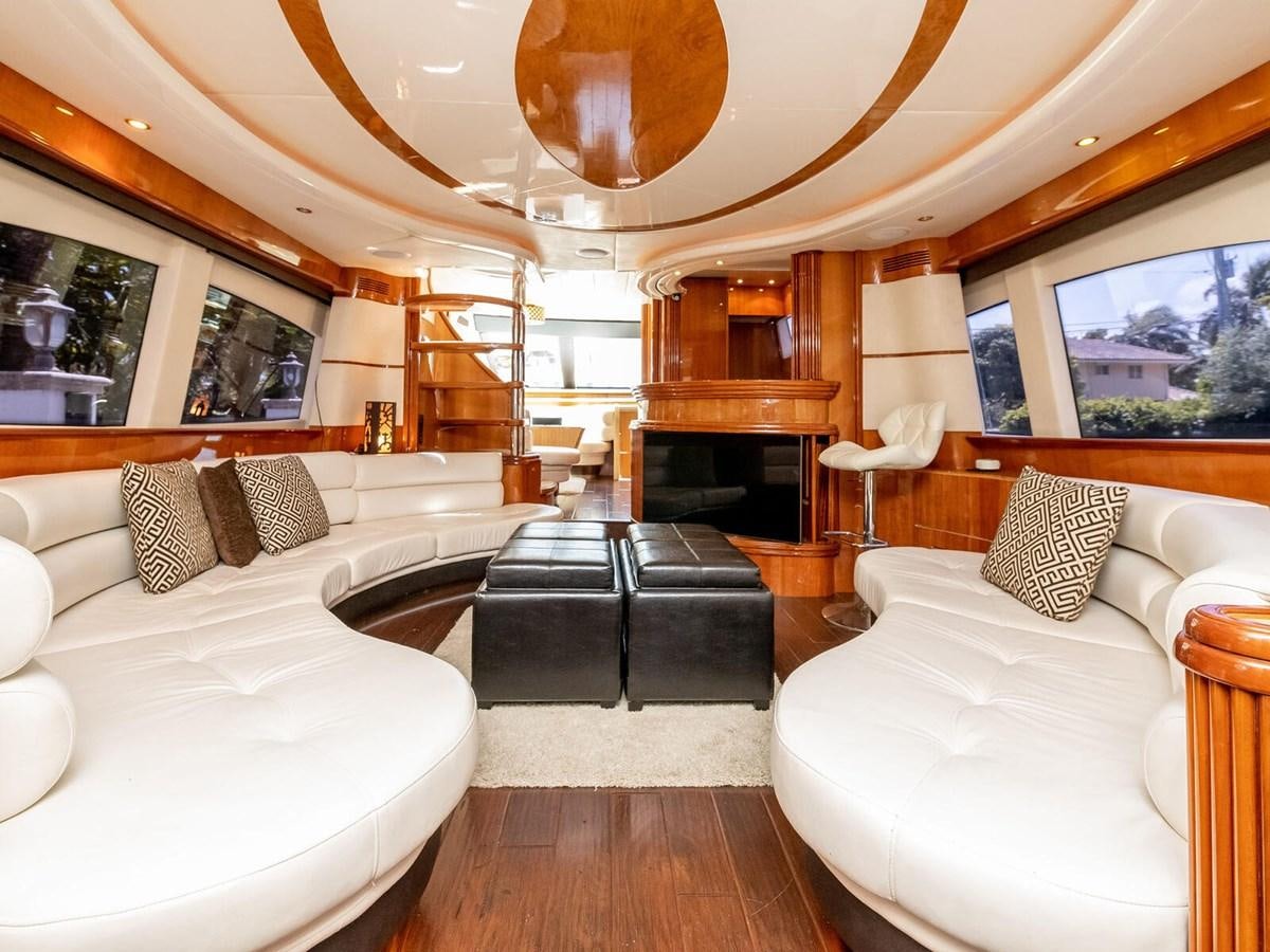 a large living room with a fireplace aboard NUEVA OLA Yacht for Sale