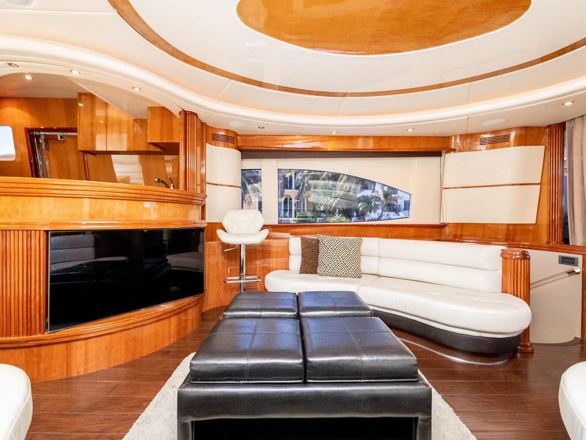 a living room with a fireplace aboard NUEVA OLA Yacht for Sale