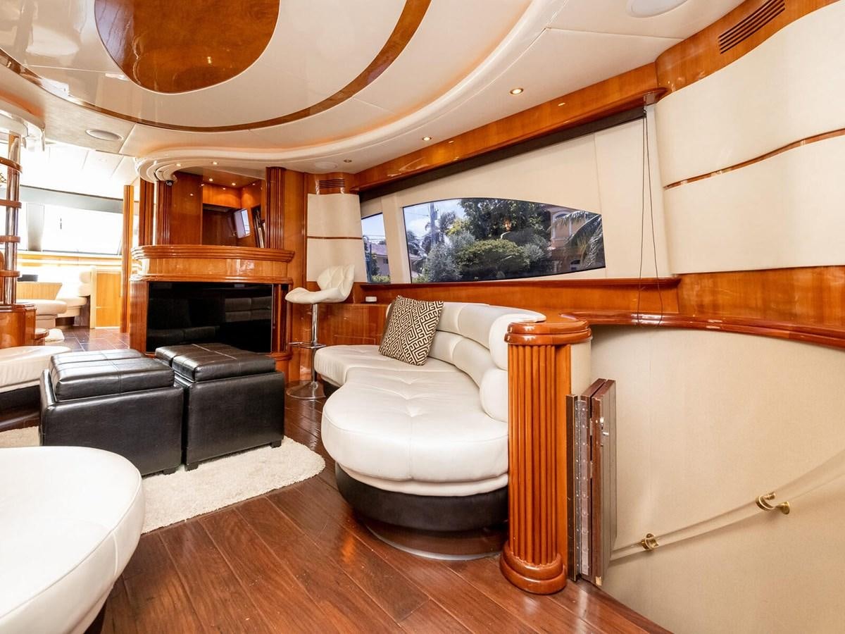 a room with a couch and a piano aboard NUEVA OLA Yacht for Sale