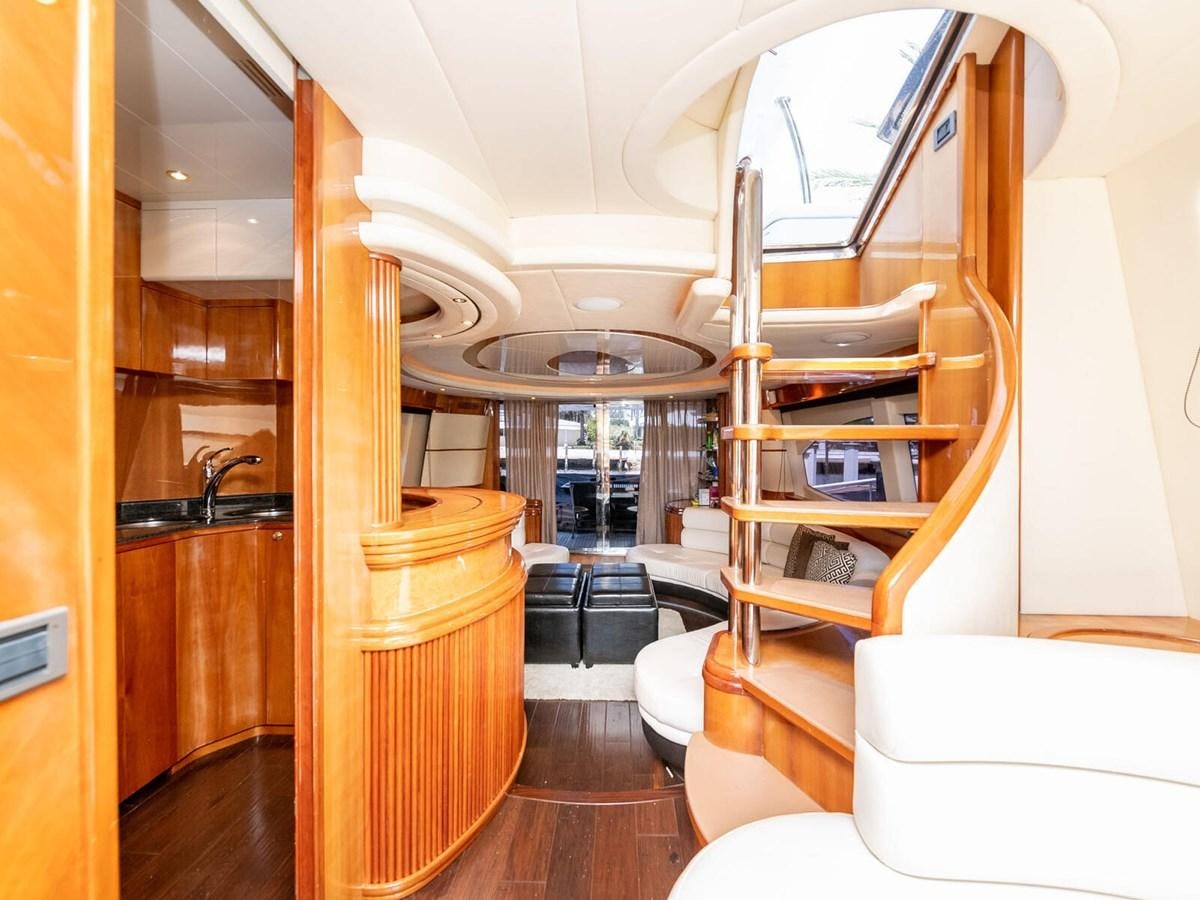a room with a staircase and a couch aboard NUEVA OLA Yacht for Sale