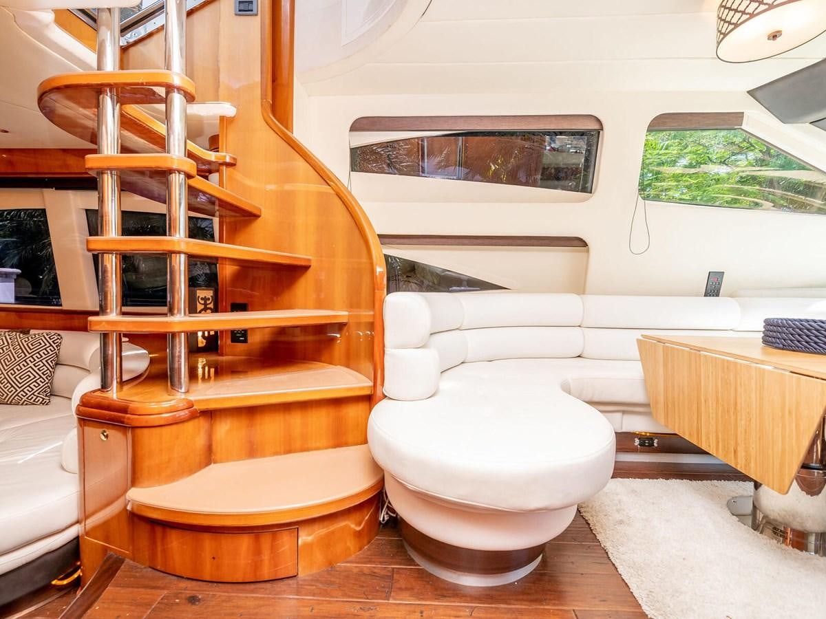 a toilet and a chair in a room aboard NUEVA OLA Yacht for Sale
