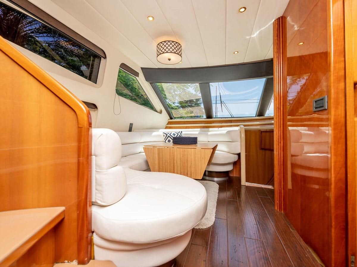 a bathroom with a wood door aboard NUEVA OLA Yacht for Sale