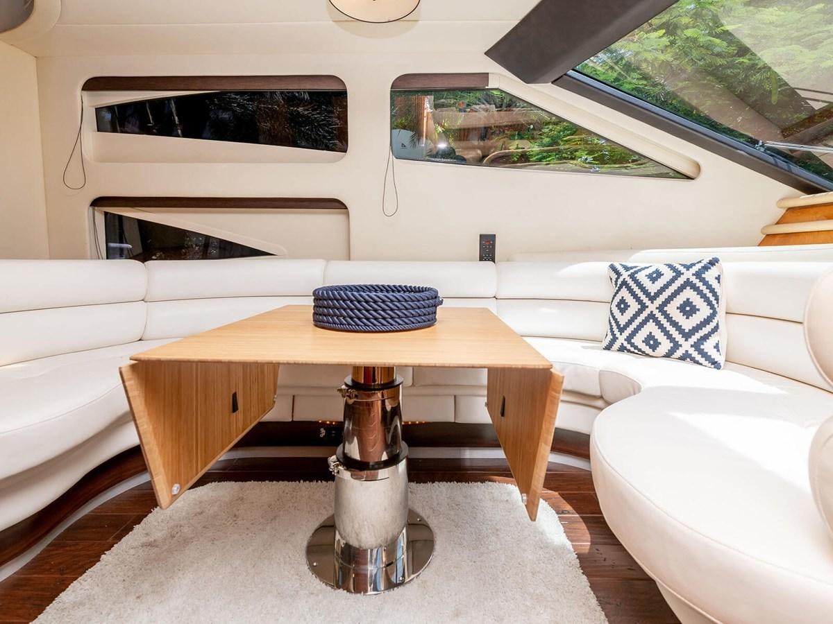 a table in a room aboard NUEVA OLA Yacht for Sale