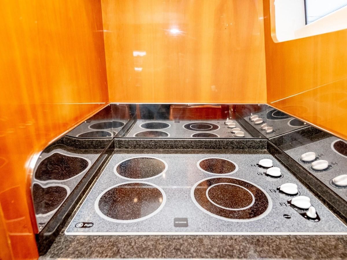 a stove with a burner and burners aboard NUEVA OLA Yacht for Sale