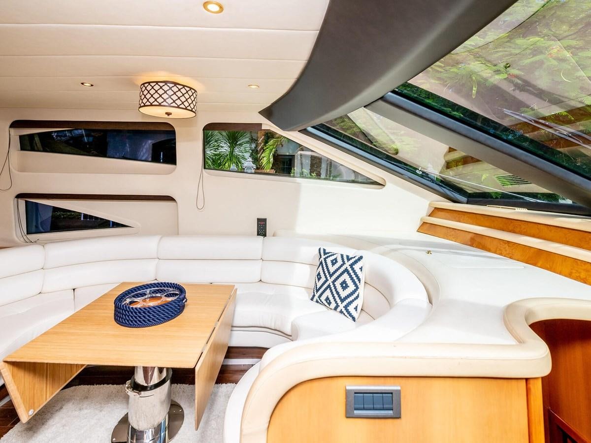 a room with a bed and a table aboard NUEVA OLA Yacht for Sale