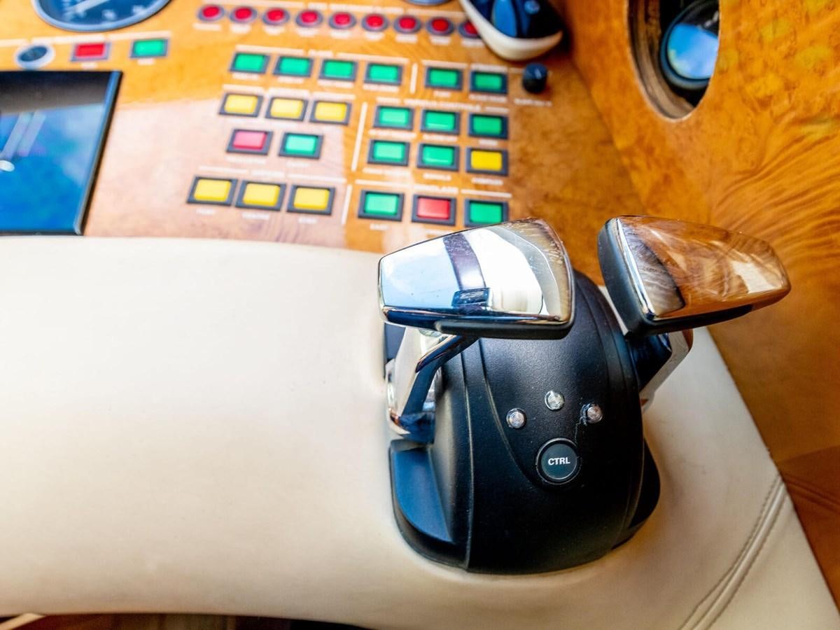 a black and silver headphones on a table aboard NUEVA OLA Yacht for Sale