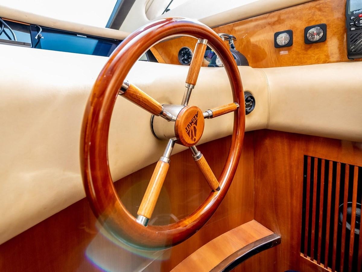an orange steering wheel aboard NUEVA OLA Yacht for Sale