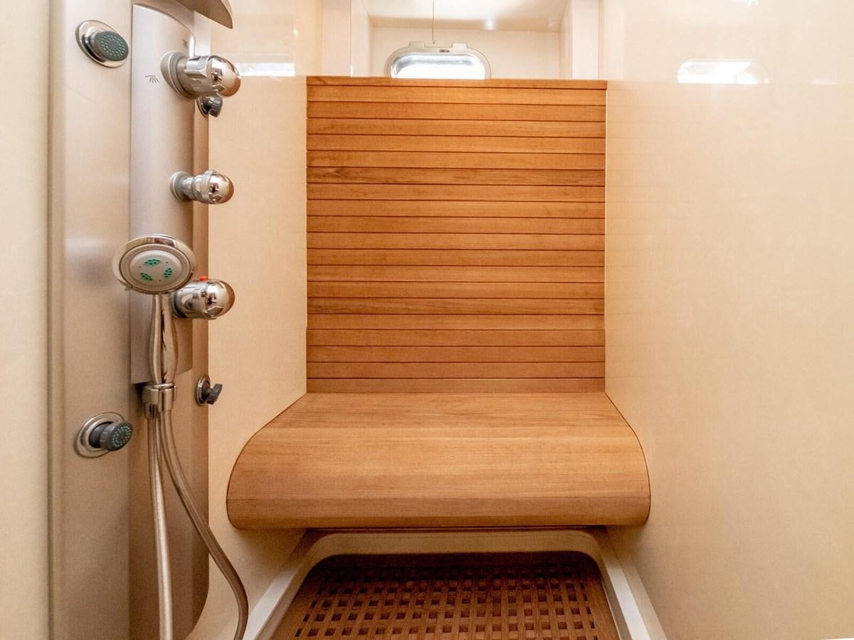 a wooden door with a metal handle aboard NUEVA OLA Yacht for Sale