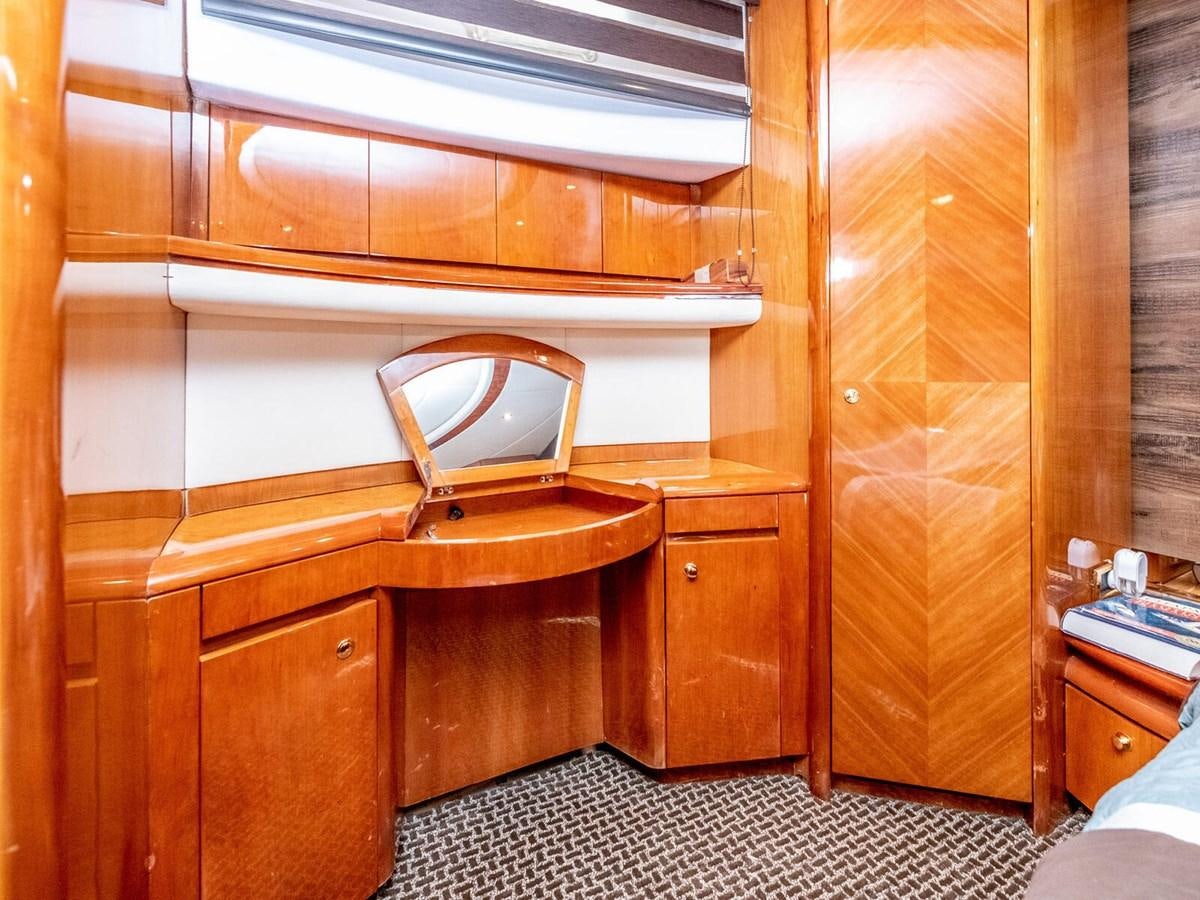 a wooden cabinet in a room aboard NUEVA OLA Yacht for Sale