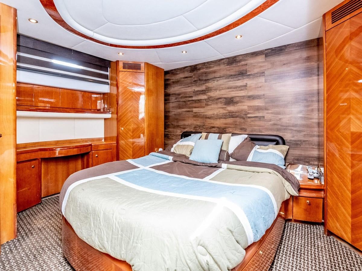 a bedroom with a bed aboard NUEVA OLA Yacht for Sale