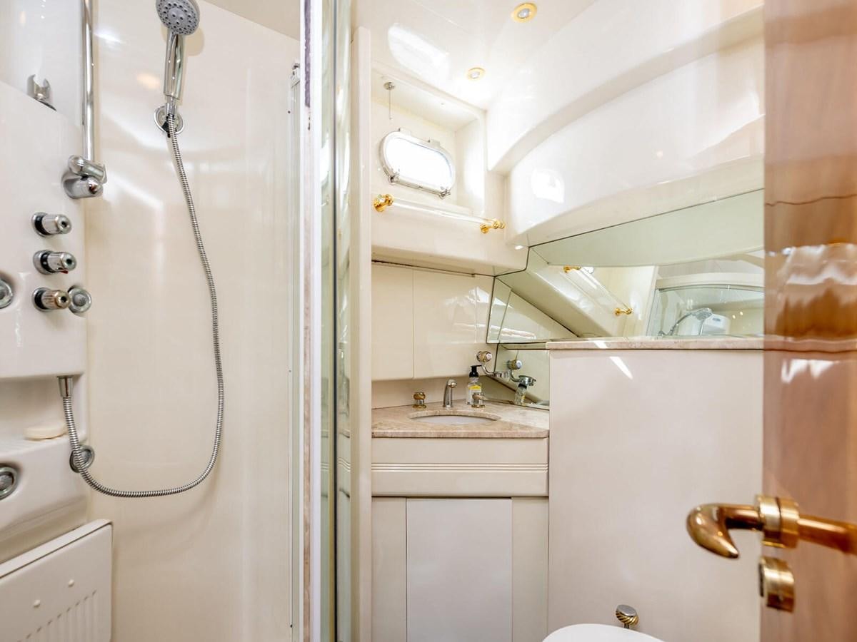 a bathroom with a shower and sink aboard NUEVA OLA Yacht for Sale