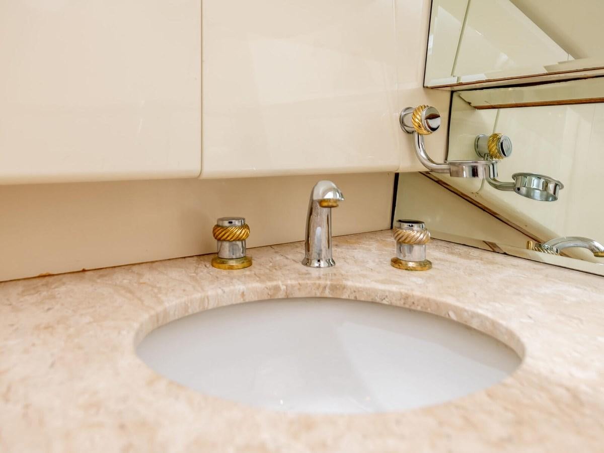 a bathroom sink with a mirror aboard NUEVA OLA Yacht for Sale