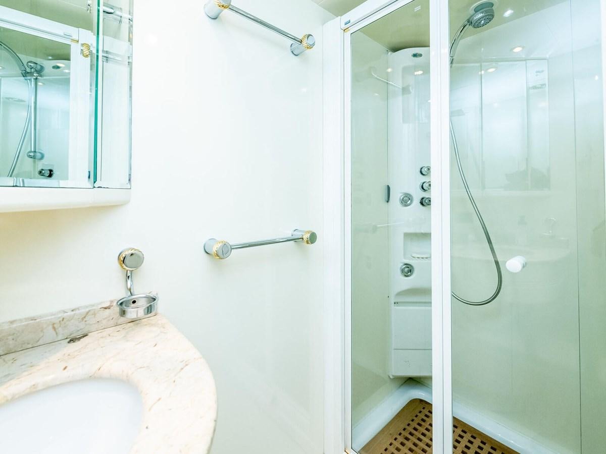 a bathroom with a glass shower aboard NUEVA OLA Yacht for Sale