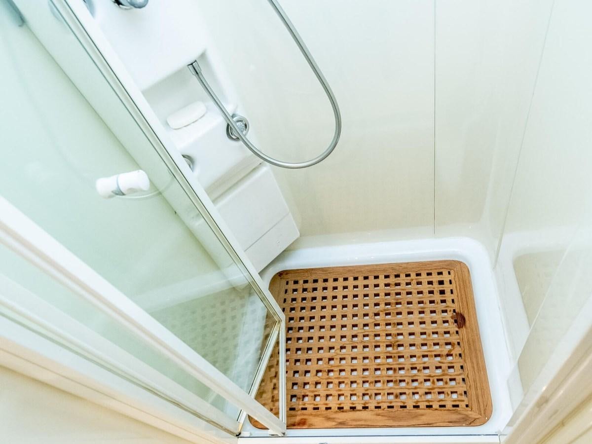 a metal basket on a white shelf aboard NUEVA OLA Yacht for Sale