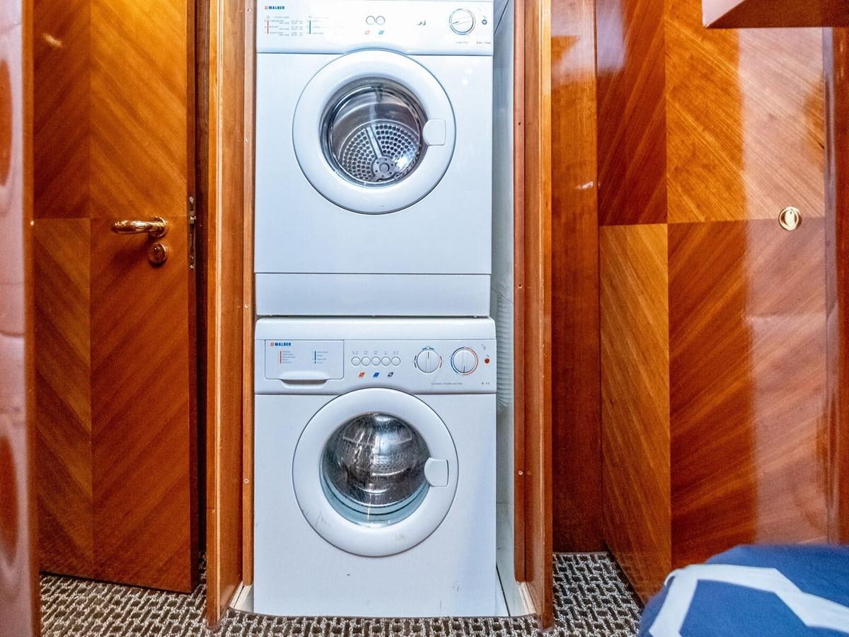 a washing machine in a closet aboard NUEVA OLA Yacht for Sale