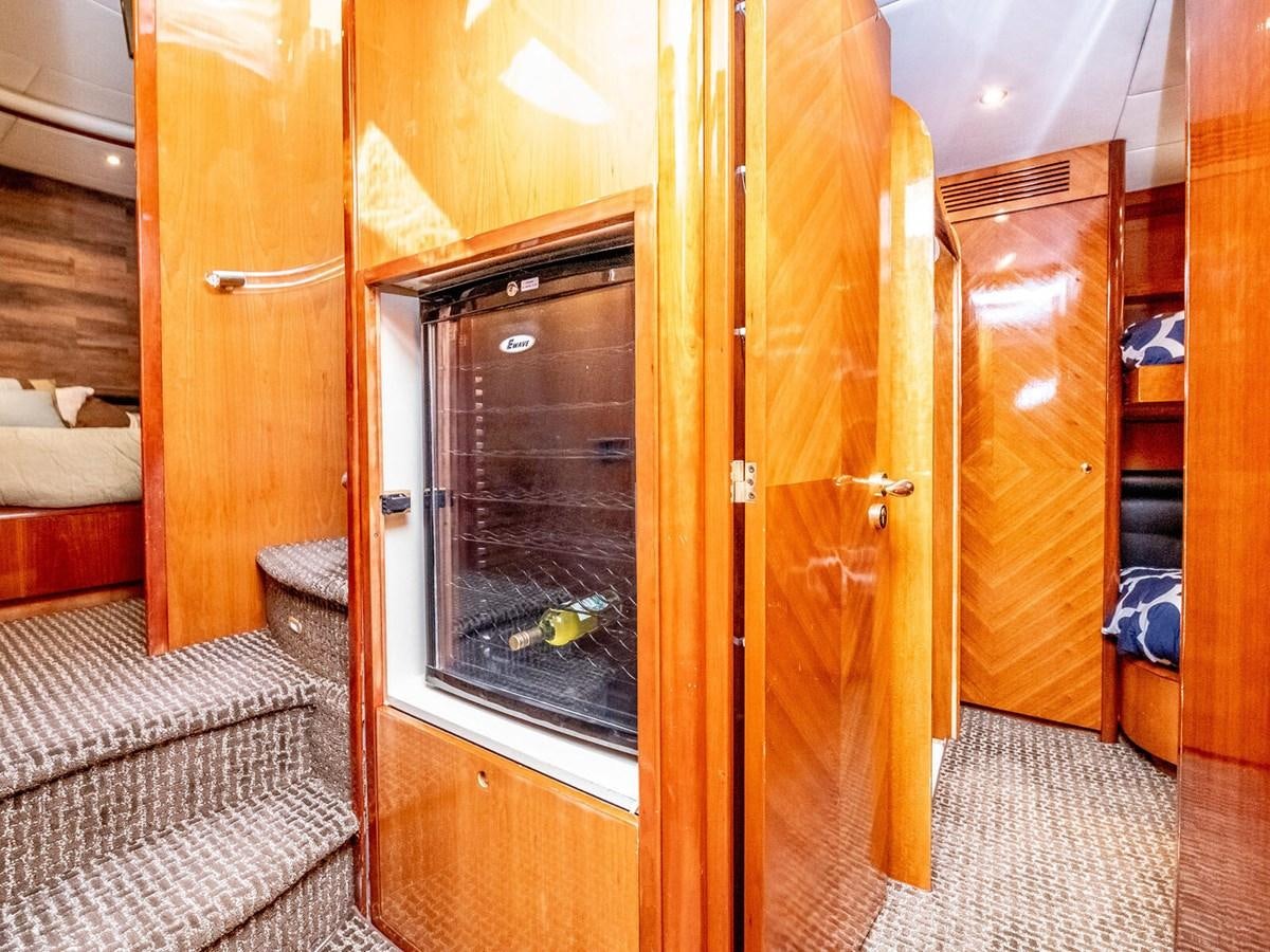 a room with a bed and a closet aboard NUEVA OLA Yacht for Sale