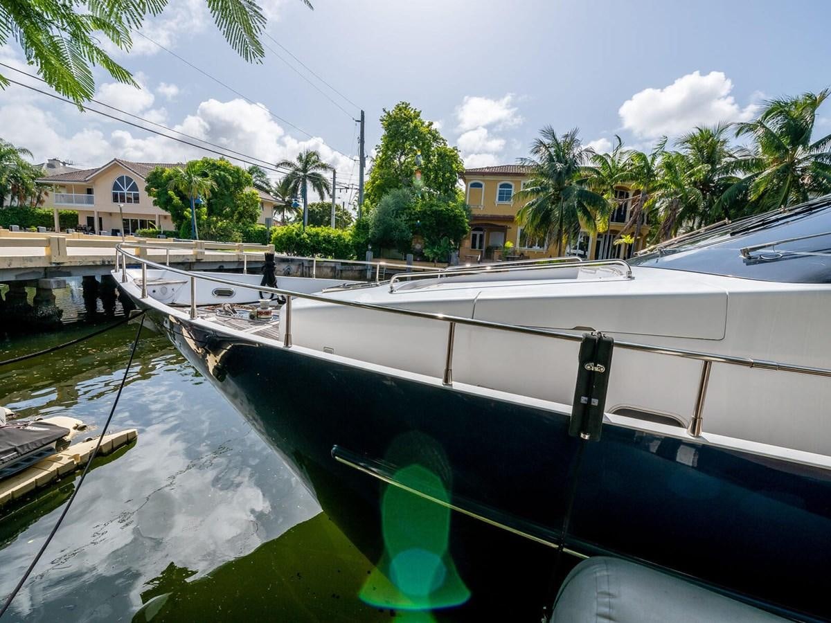 a boat parked on the side of a river aboard NUEVA OLA Yacht for Sale