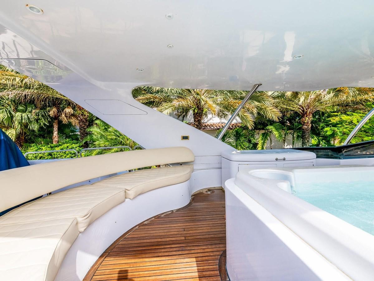 a deck with a pool and trees aboard NUEVA OLA Yacht for Sale