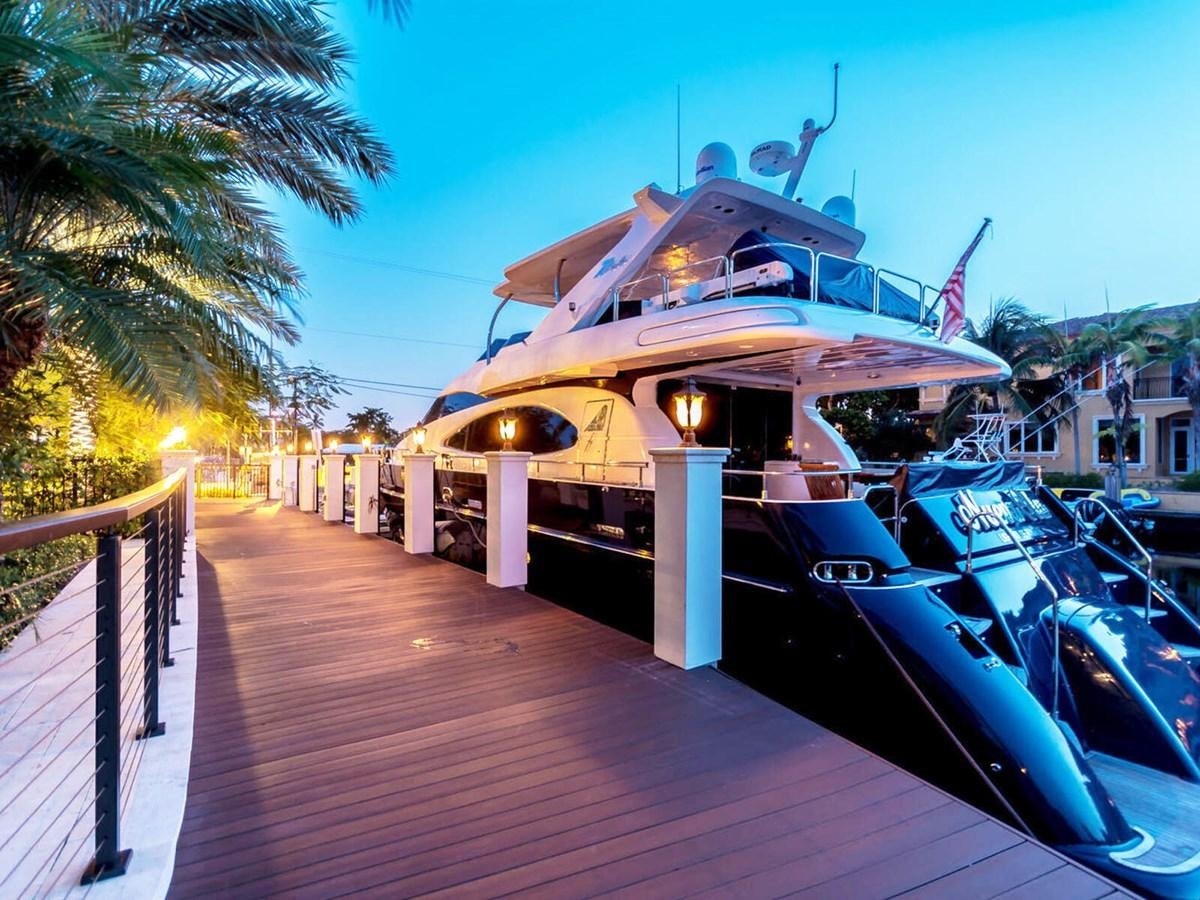 a boat docked at a pier aboard NUEVA OLA Yacht for Sale