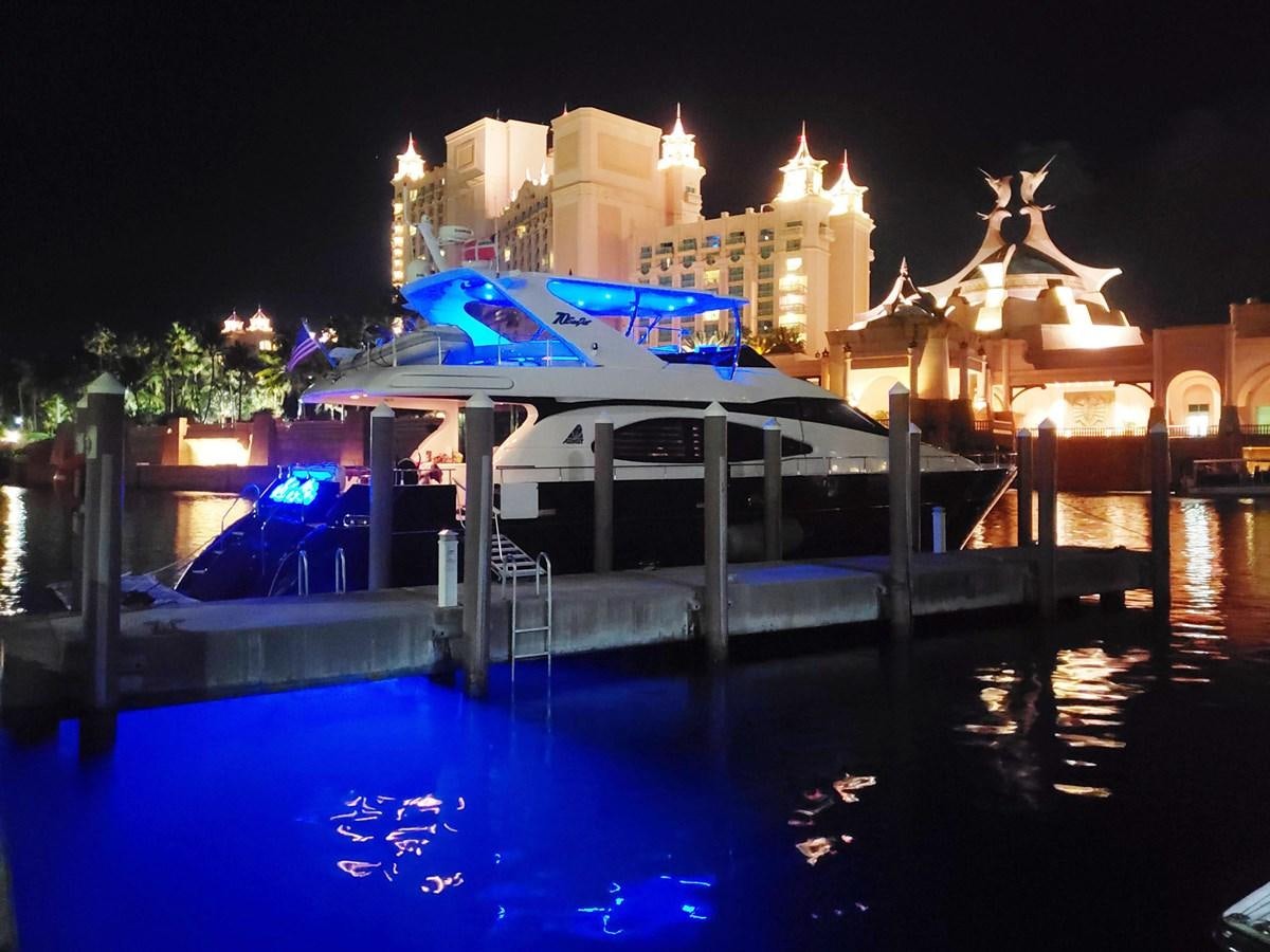 a pool with a large building in the background aboard NUEVA OLA Yacht for Sale
