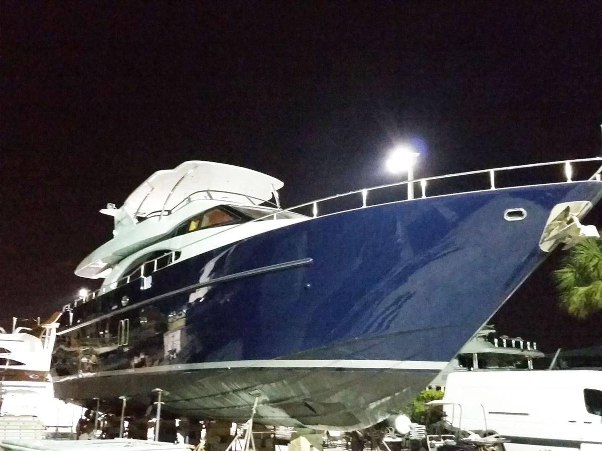 a large cruise ship docked at night aboard NUEVA OLA Yacht for Sale