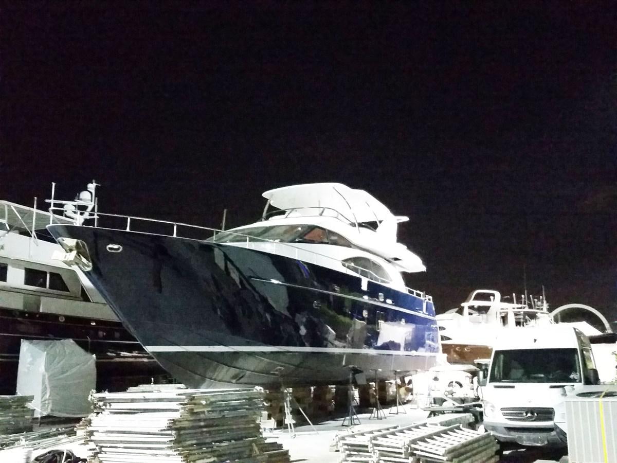 a docked boat at night aboard NUEVA OLA Yacht for Sale