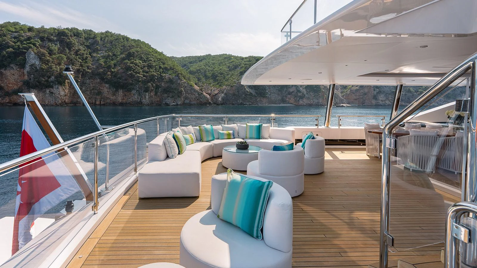 a deck with a view of the water and trees aboard SEAGULL MRD Yacht for Sale