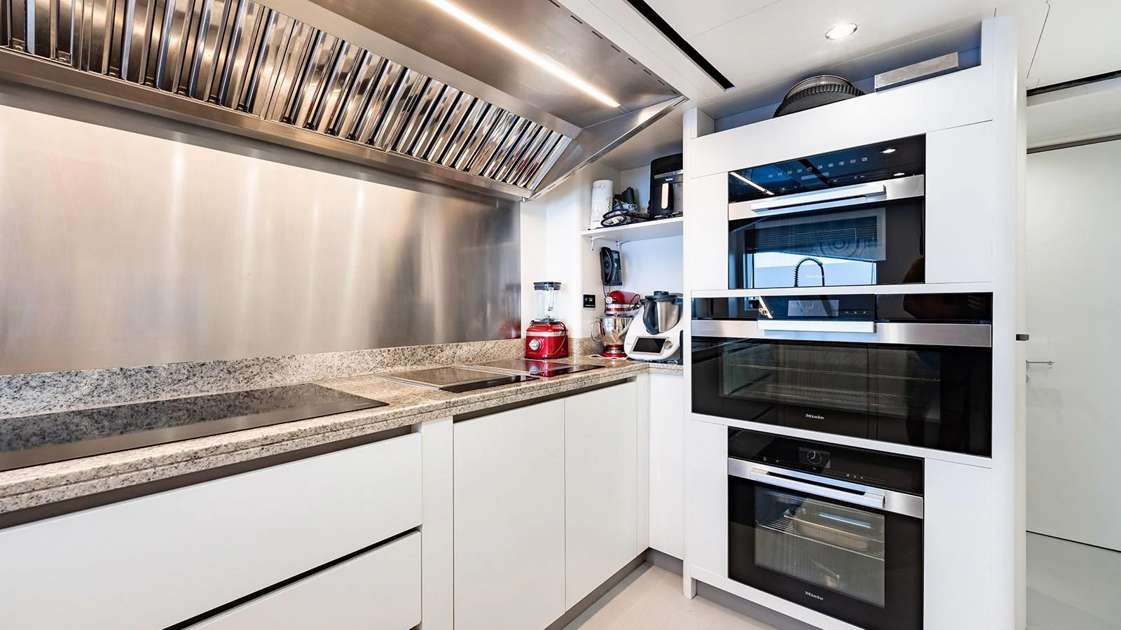 a kitchen with white cabinets aboard SEAGULL MRD Yacht for Sale
