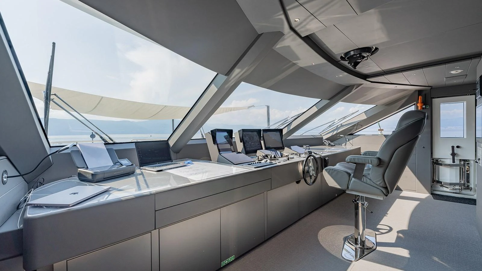 an office with a large desk and chairs aboard SEAGULL MRD Yacht for Sale