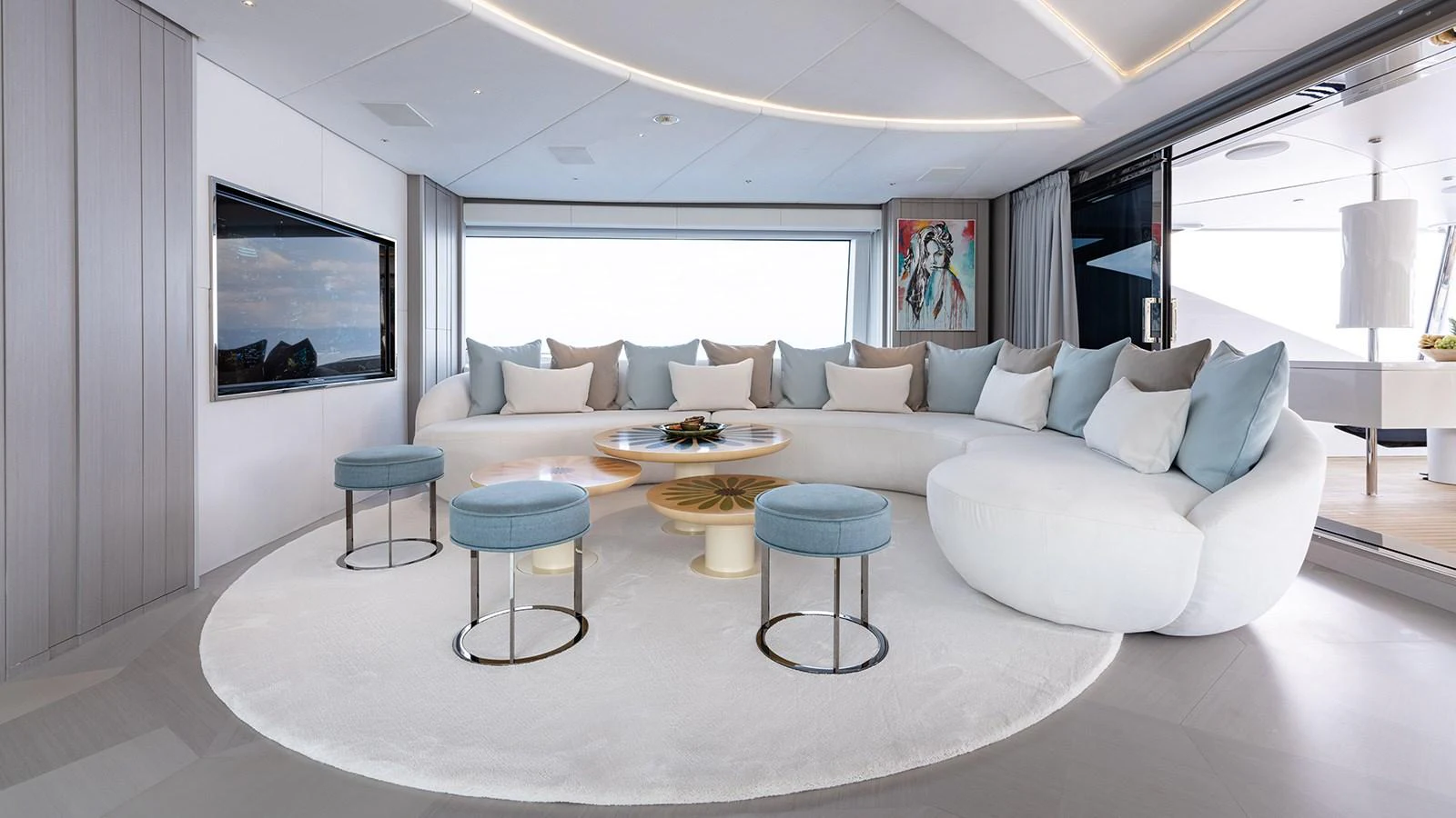 a living room with a large white couch and a flat screen television aboard SEAGULL MRD Yacht for Sale