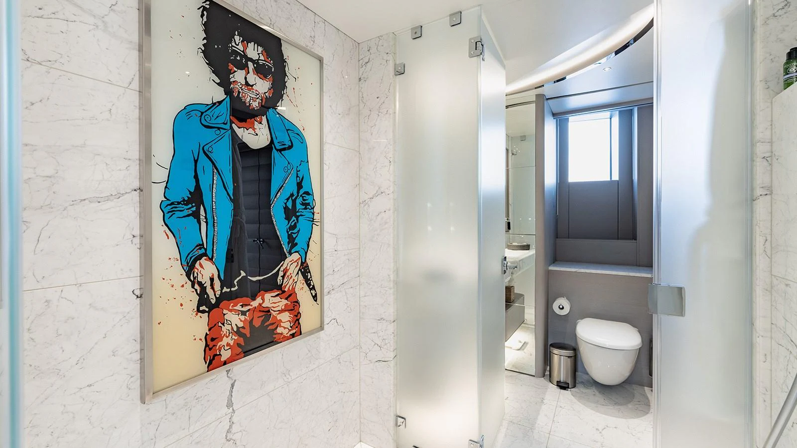a bathroom with a painting on the wall aboard SEAGULL MRD Yacht for Sale
