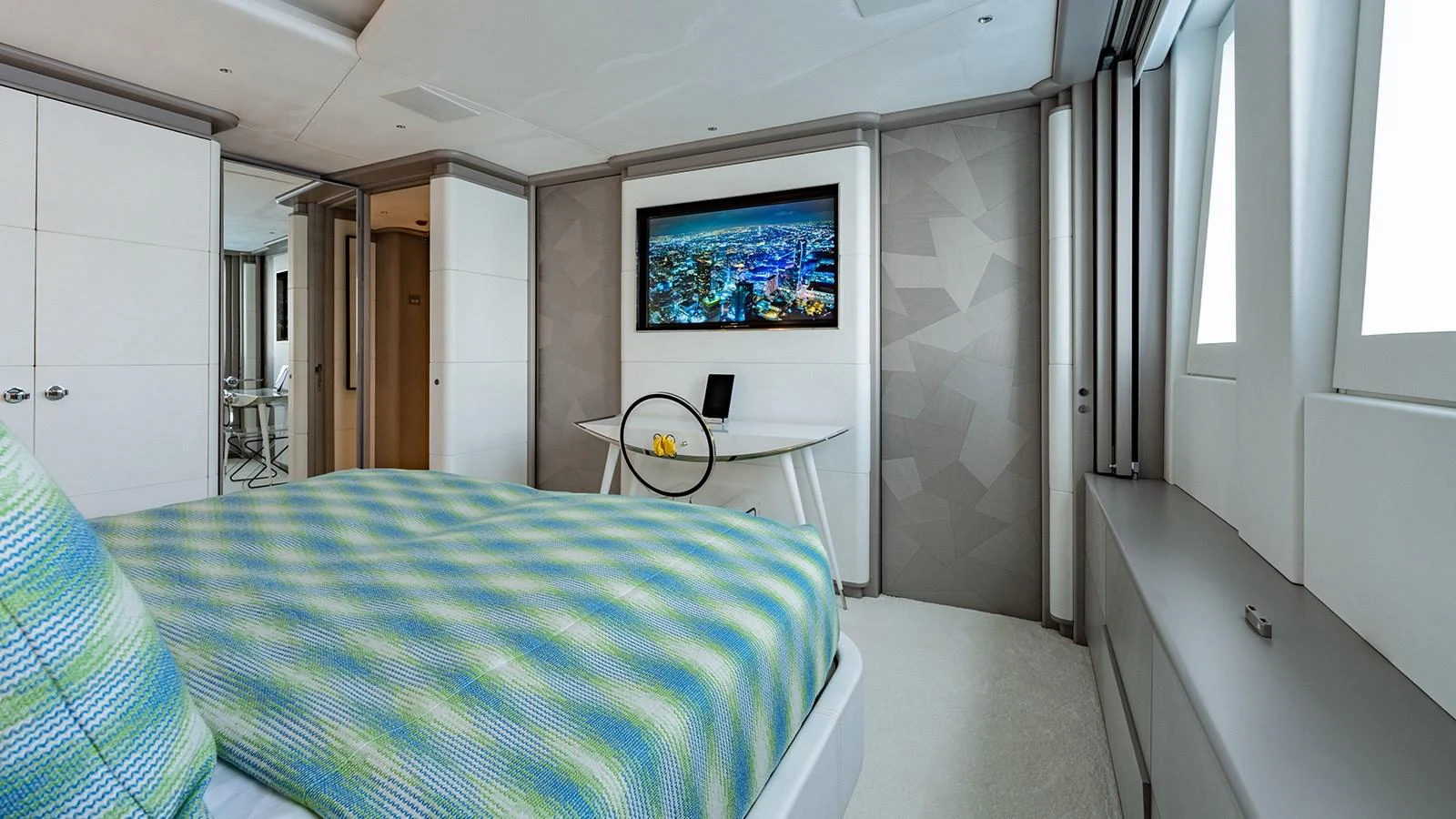 a bedroom with a bed and a tv on the wall aboard SEAGULL MRD Yacht for Sale