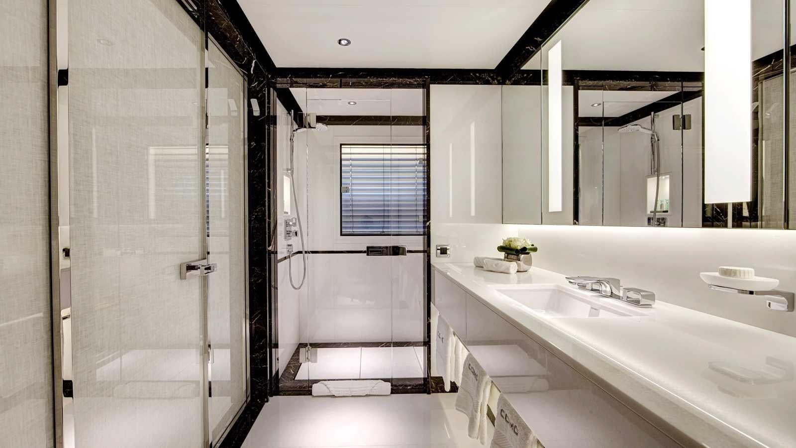 a bathroom with sinks and a shower aboard EXCELLENCE V Yacht for Sale