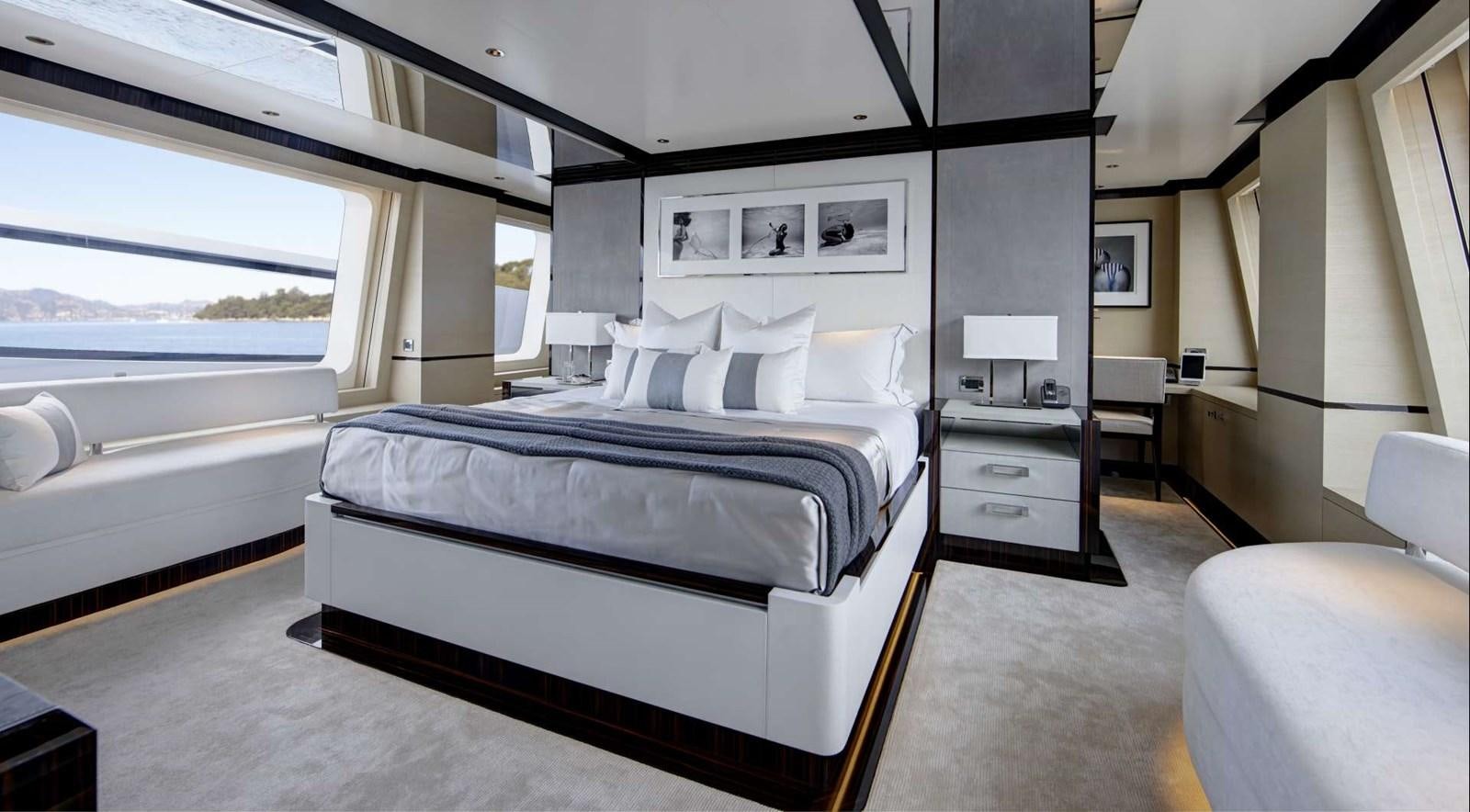 a large bedroom with a large bed aboard EXCELLENCE V Yacht for Sale