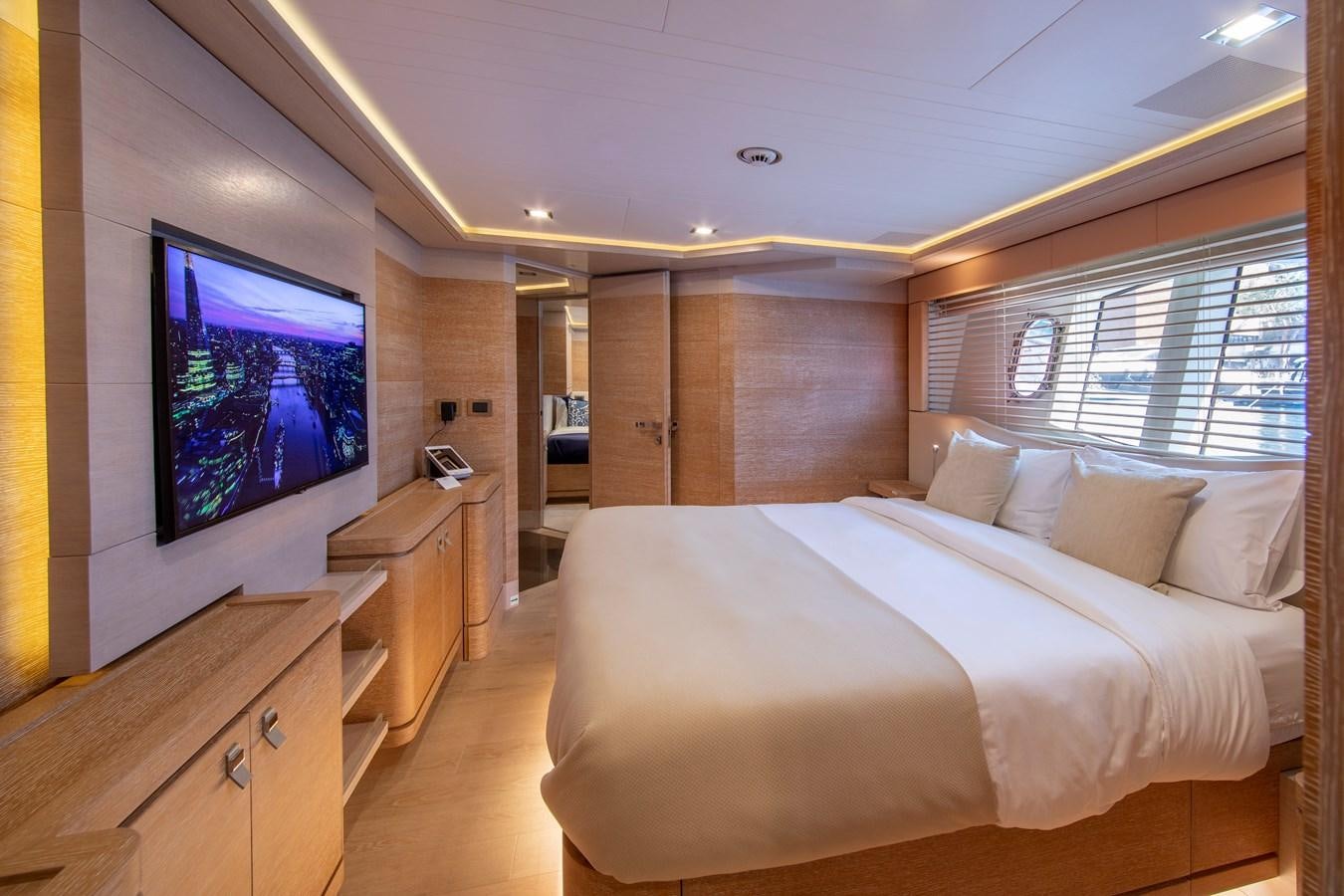 a bedroom with a large bed aboard CENTURION Yacht for Sale